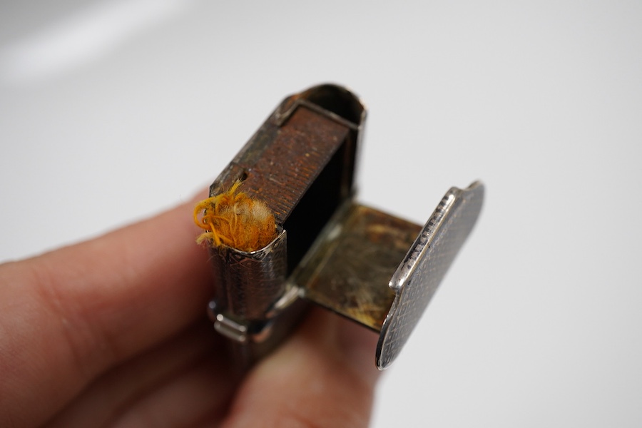 A 19th century continental engine turned parcel gilt white metal vesta case, 66mm, (lion head mark), together with two late 19th century continental white metal and niello vesta cases, one decorated with game.